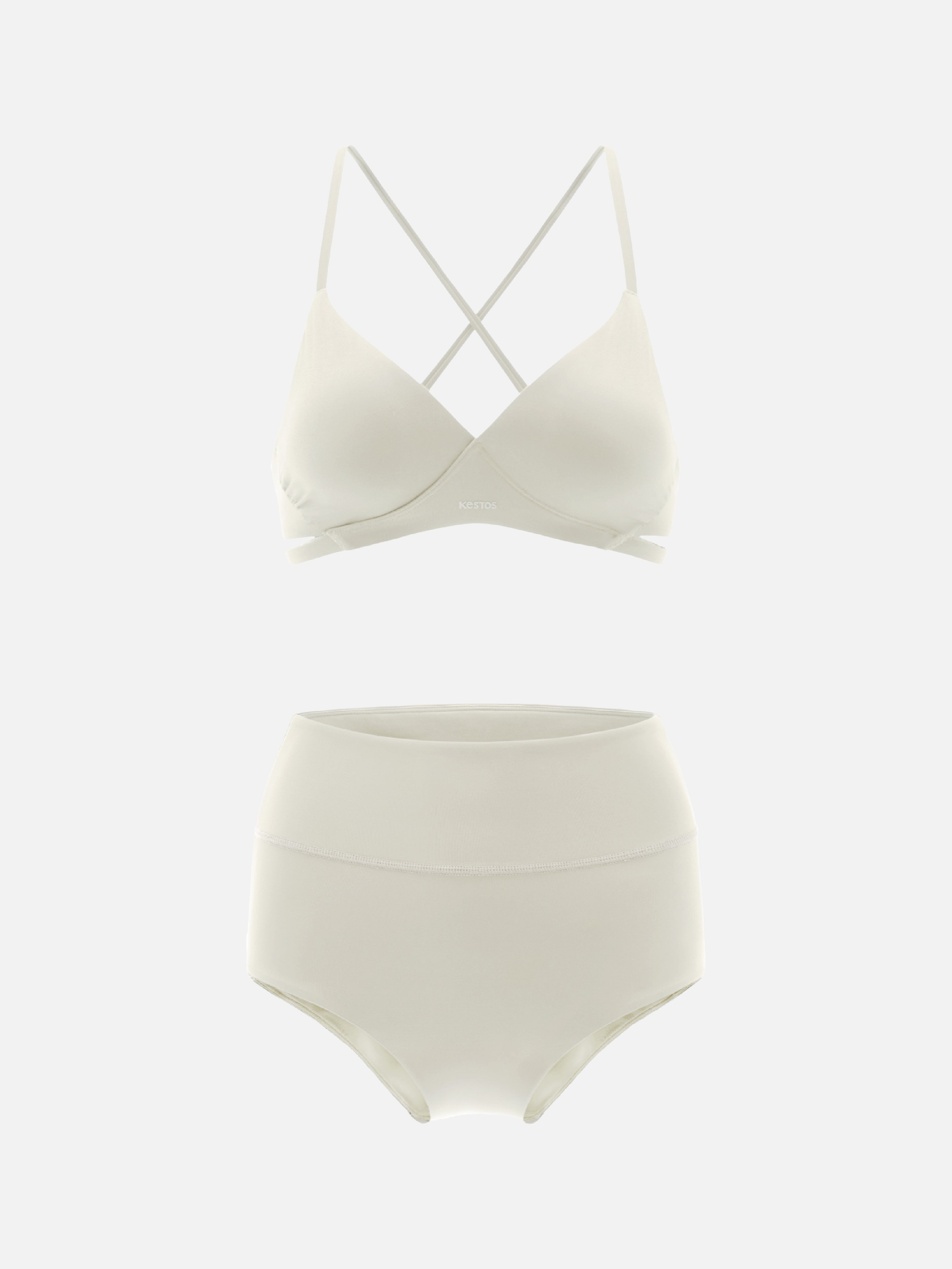 White bikini set with a strappy top and high-waisted bottom on a light gray background