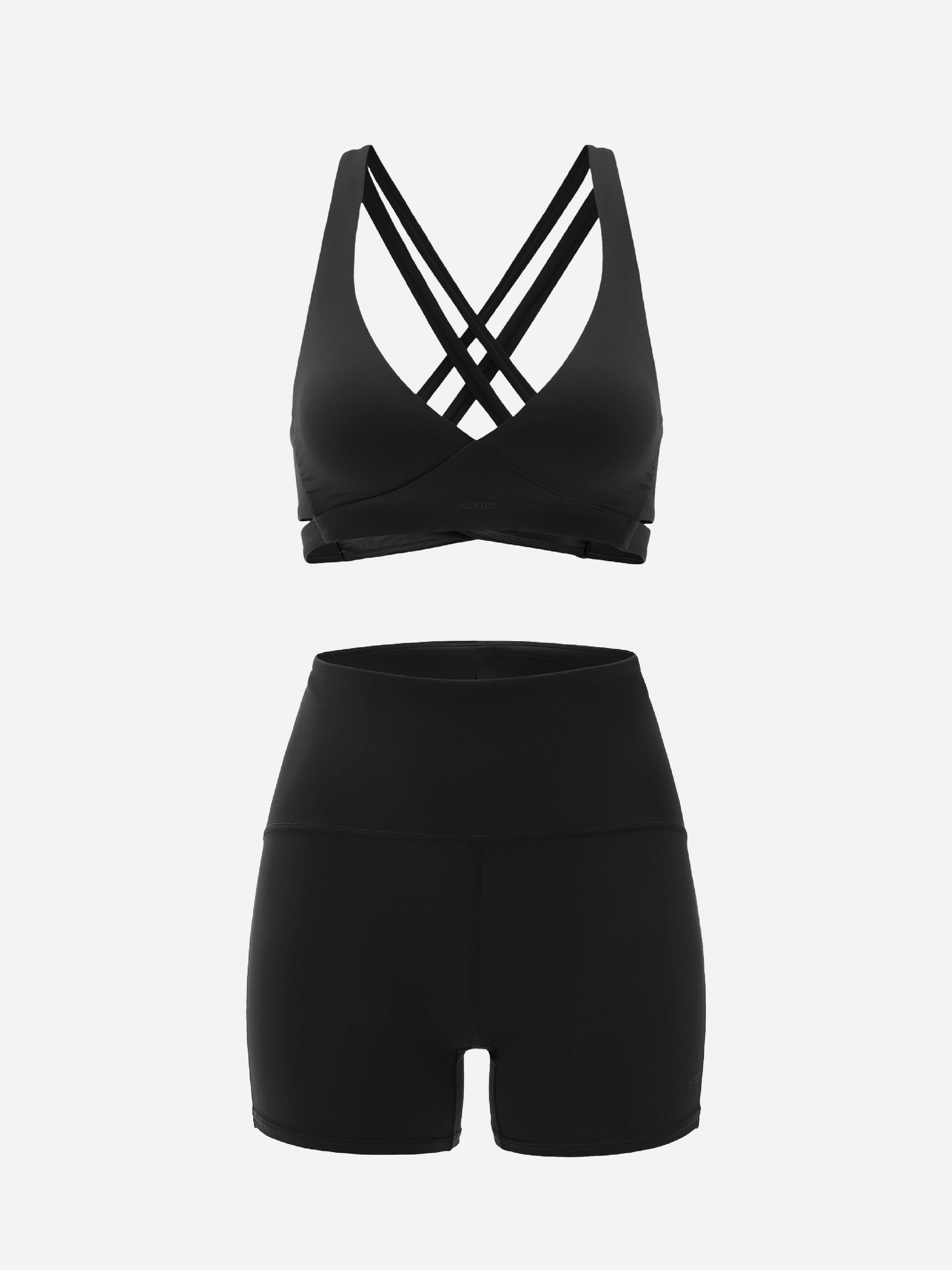 Black sports bra and shorts set on a white background