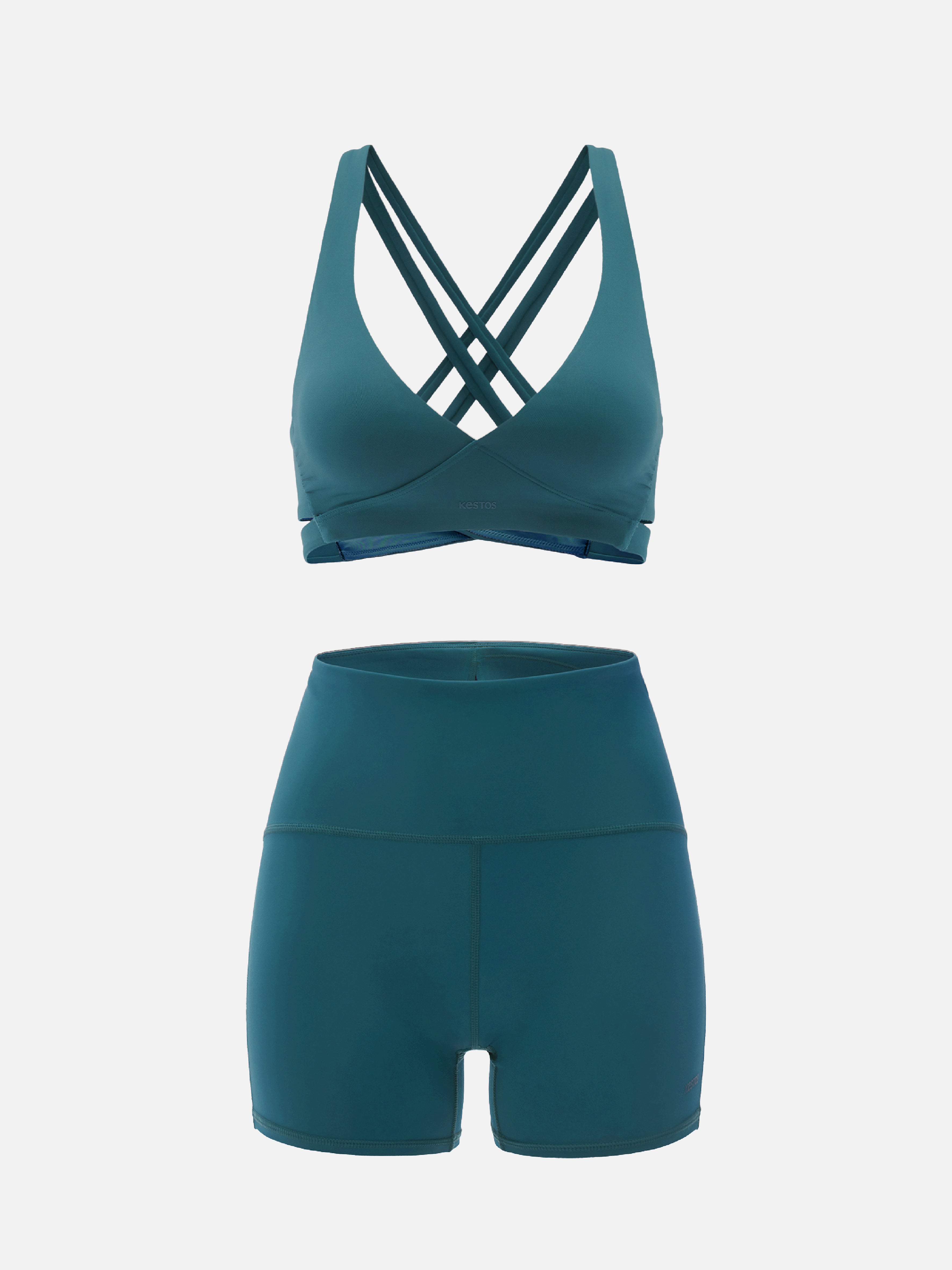 Teal sports bra and shorts set on a white background